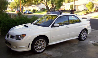 This is the sort of roof rack setup I am looking to go for, but they are quite expensive!